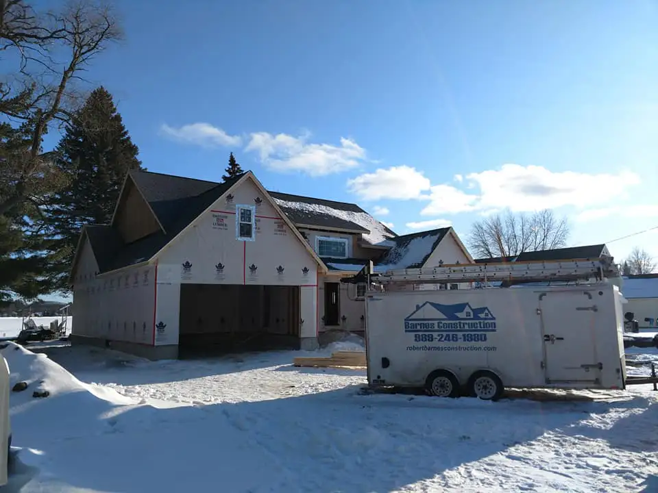 Residential home with new roof shingles installed in Beaverton Michigan