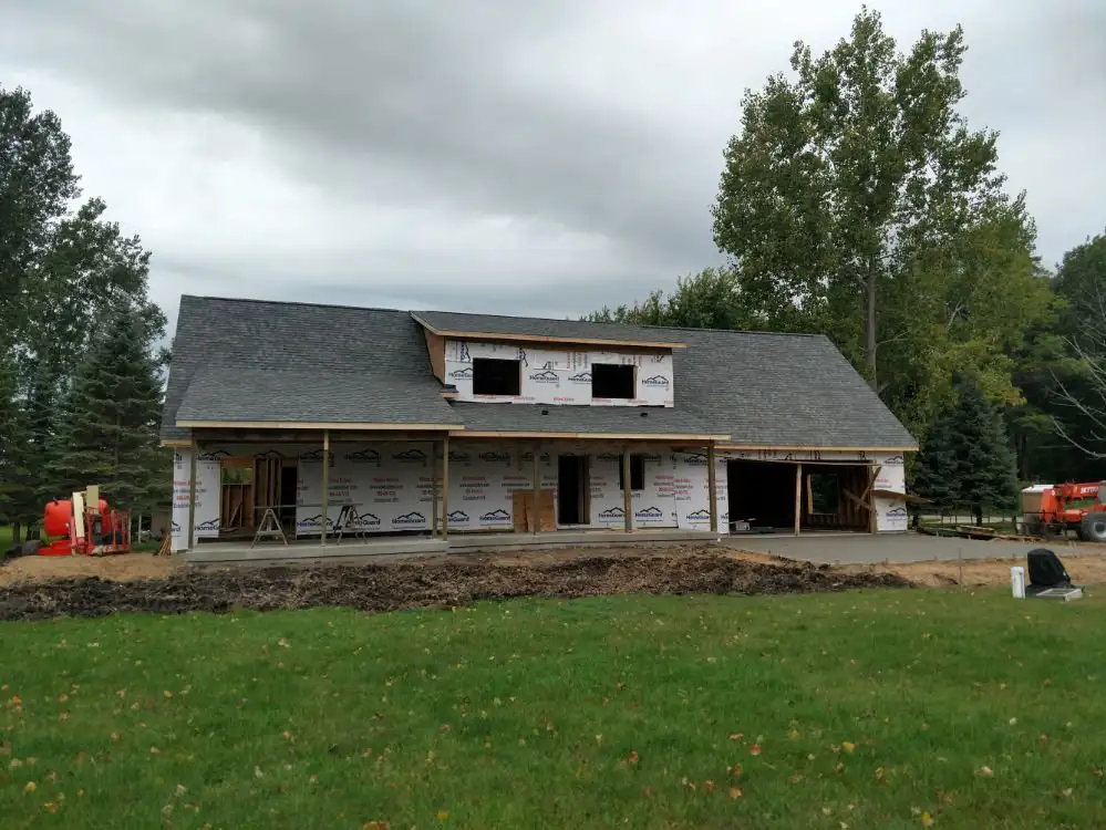 Roof repair in progress on a Beaverton Michigan home