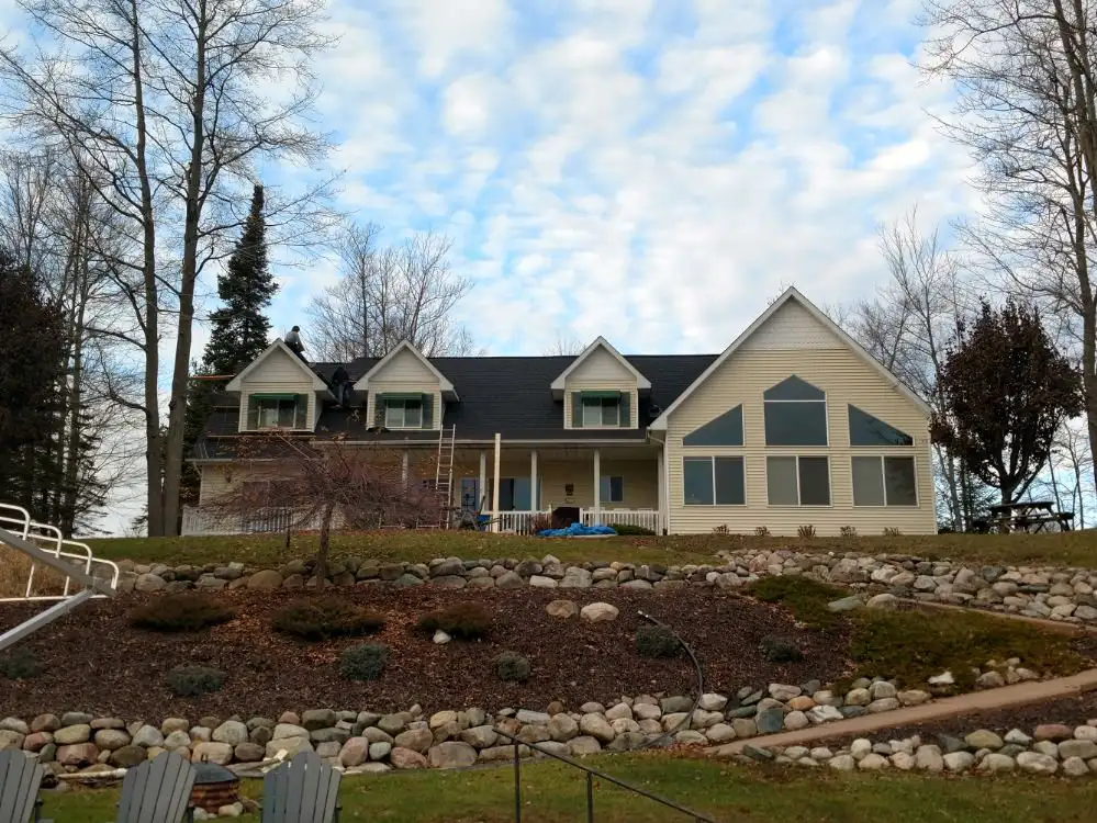 Damaged shingles on a Michigan home needing repair