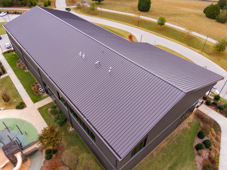 Metal roofing installed to withstand Michigan winter weather