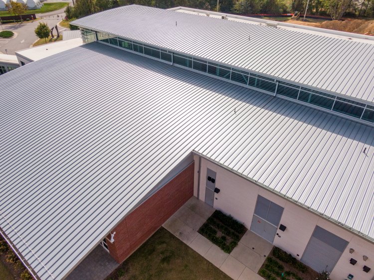 Barnes Construction metal roof installation process in Gladwin Michigan